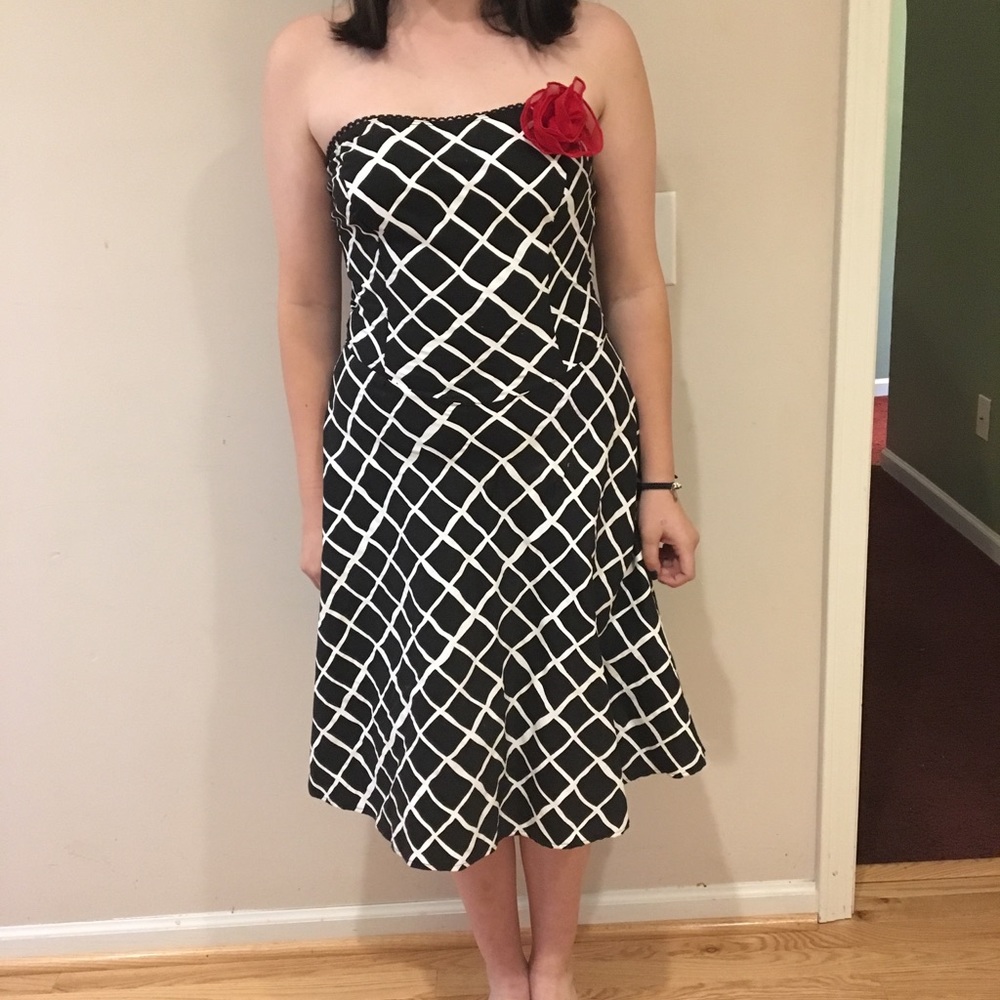 Strapless pin up style dress with red flower